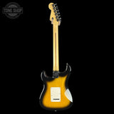 Electric guitar with a sunburst finish on a black background, featuring the Tone Shop logo.