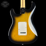 Electric guitar with a sunburst finish on a black background, featuring the Tone Shop logo.
