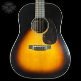 Acoustic guitar with a sunburst finish on a black background, featuring the Tone Shop logo.