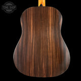 Wooden acoustic guitar back with 'Tone Shop' logo in the corner