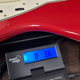 Used 2022 Fender American Vintage II 66 Jazzmaster Dakota Red on scale displaying weight.