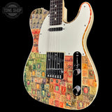 A Fender Telecaster-style electric guitar with a vintage postage stamp collage finish on the body, featuring a cream pickguard and black hardware, shown against a black background with a Tone Shop watermark.