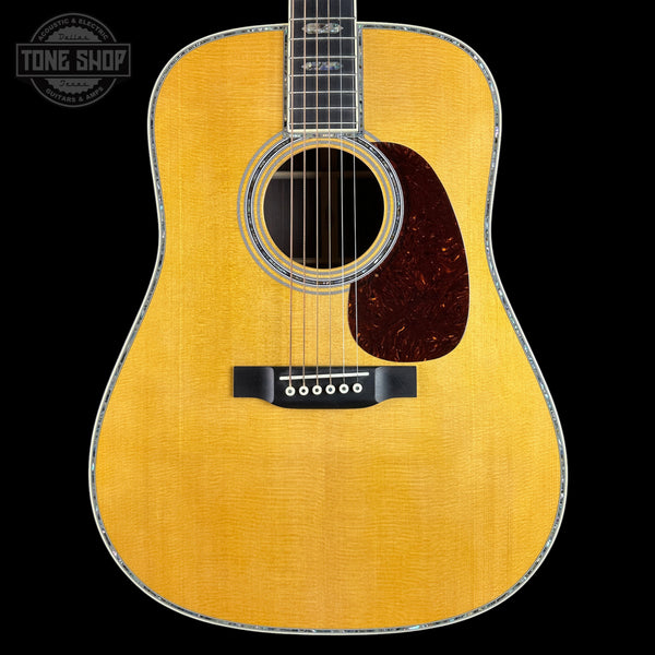 Acoustic guitar with a visible brand logo in the corner