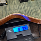 Used 2018 PRS McCarty 594 Singlecut Trampas Green 10-Top on scale displaying weight.