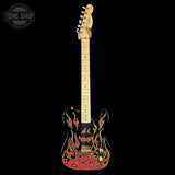 A black electric guitar with a red and gold flame pattern on the body, shown against a solid black background. A Tone Shop watermark is visible in the top-left corner.