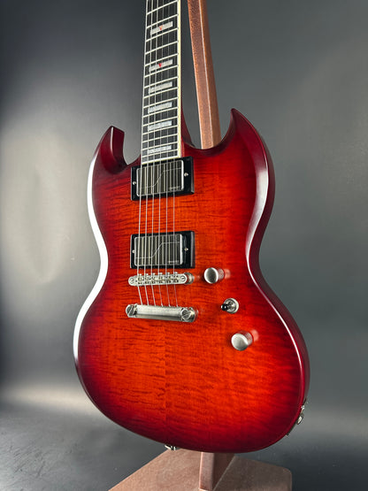 Close-up of a red electric guitar on a gray background