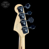Guitar headstock with tuning pegs on a black background, featuring 'Tone Shop' logo.
