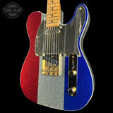 A custom glitter-finish electric guitar with a vertical tricolor design of red, silver, and blue, featuring a black pickguard and gold hardware, shown against a solid black background.