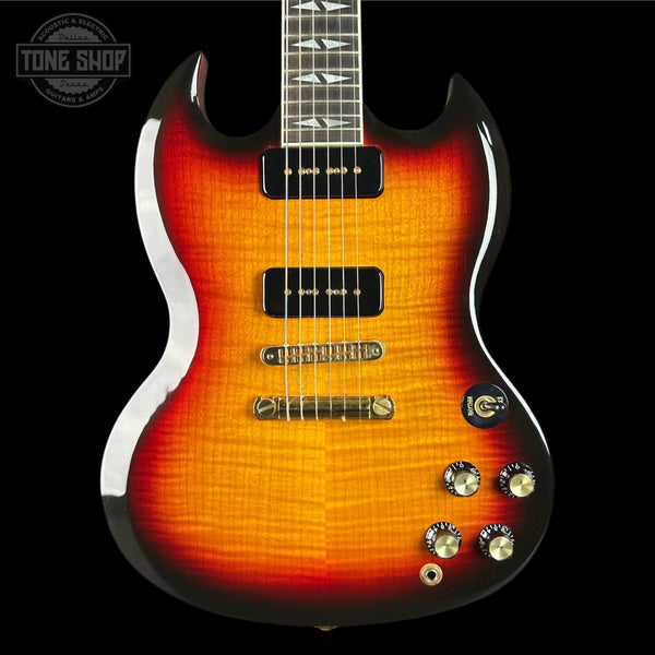 Electric guitar with a sunburst finish on a black background, featuring the Tone Shop logo.