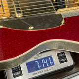 Used Fender Limited Buck Owens Telecaster on scale displaying weight.