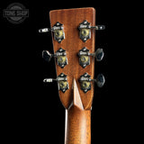 Close-up of a guitar headstock showing six tuning pegs with decorative black and gold metal covers, on a black background. A Tone Shop watermark is visible in the top-left corner.