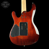 Electric guitar with a red finish on a black background, featuring the Tone Shop logo.