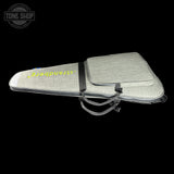 Gray guitar case with 'Strandberg' branding on a black background