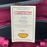Gretsch certificate of authenticity card inside a guitar case