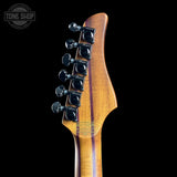 Guitar headstock with tuning pegs on a black background, featuring 'Tone Shop' branding.