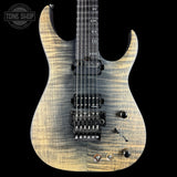Electric guitar with a sunburst finish on a black background, featuring the Tone Shop logo.
