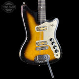 Electric guitar with a sunburst finish on a black background, featuring the Tone Shop logo.
