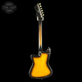 Vintage electric guitar with a sunburst finish on a black background, featuring the Tone Shop logo.