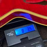 Gibson Custom Limited Edition 1960 ES-355 Sixties Cherry Light Aged on scale displaying weight.