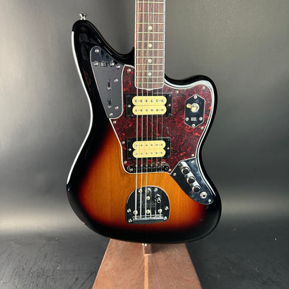 Electric guitar with a sunburst finish on a gray background
