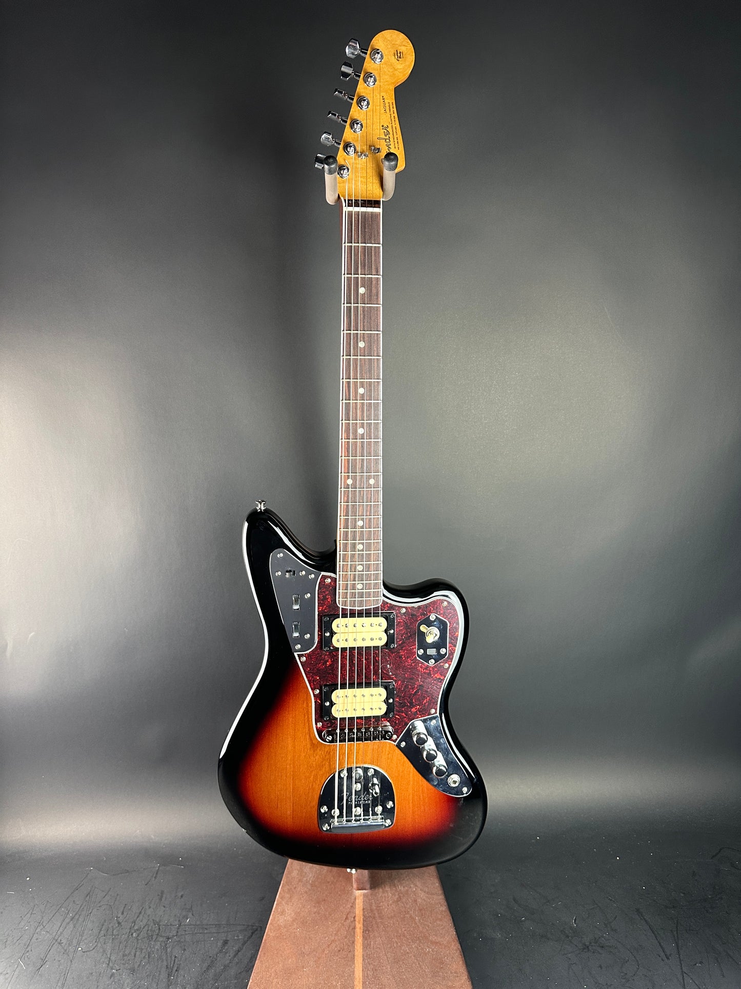 Electric guitar with a sunburst finish on a dark gray background