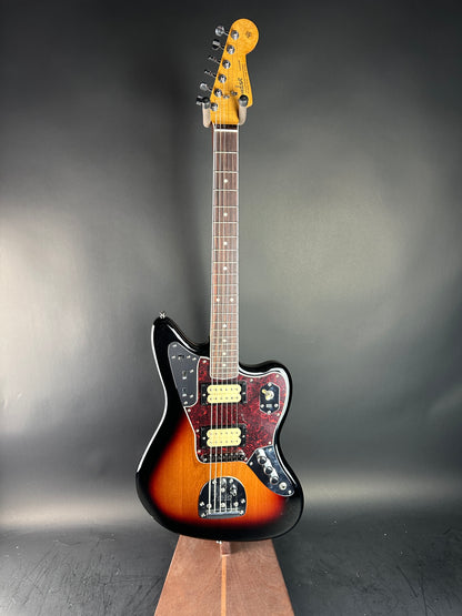 Electric guitar with a sunburst finish on a dark gray background