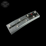 Guitar pedal with control knobs and display on a black background, featuring 'Tone Shop' branding.