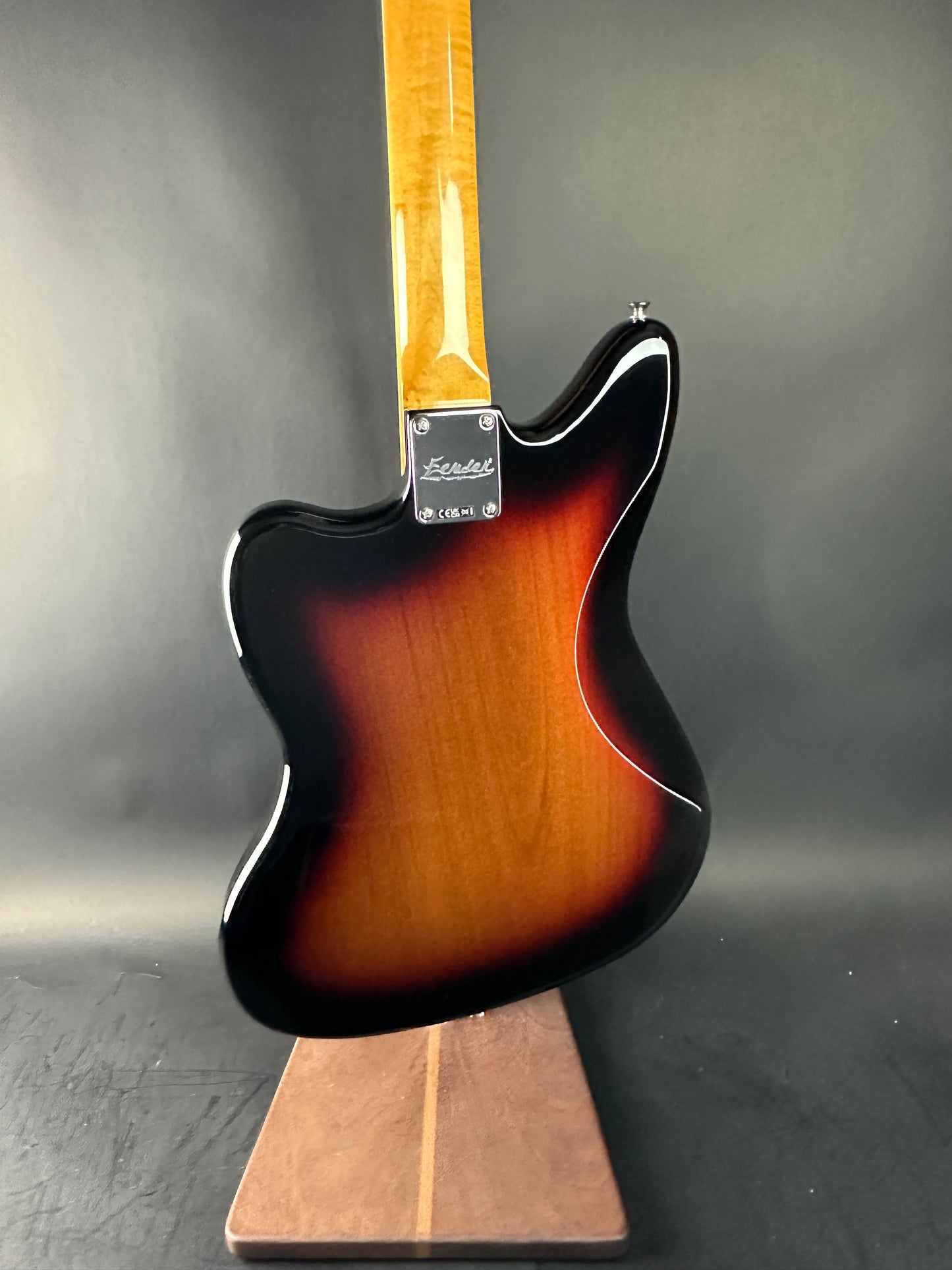 Guitar body with a sunburst finish on a dark gray background