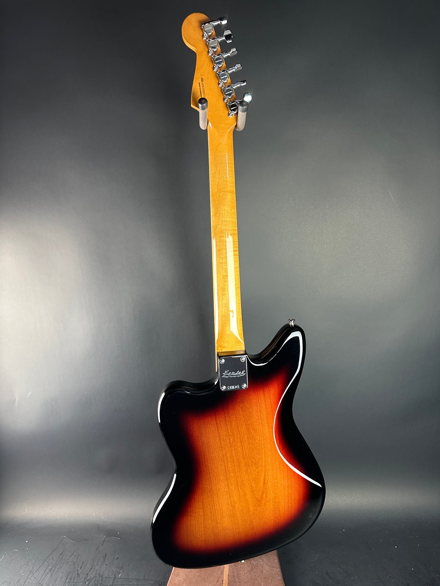 Electric guitar with sunburst finish on a dark gray background