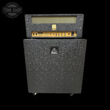 Guitar amplifier with speaker cabinet on a black background, featuring the Tone Shop logo.