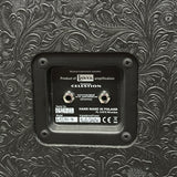 Decorative speaker with branding and technical details on a textured surface