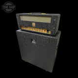 Guitar amplifier with speaker cabinet on a black background, featuring 'Tone Shop' logo.