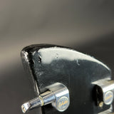 Close-up of a guitar tuning peg with a blurred background