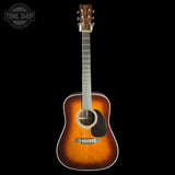 A classic acoustic guitar with a sunburst finish, shown from the front against a solid black background. The brand name 'Taylor' is visible on the headstock.