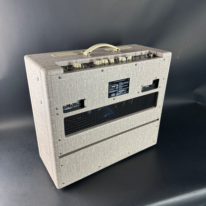 Guitar amplifier with textured gray finish on a dark background