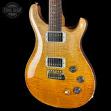 Front angle of Used PRS TSG Anniversary Wood Library Artist DGT Gold Storm Fade/Braz RW.