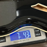 Digital kitchen scale displaying weight on a wooden surface