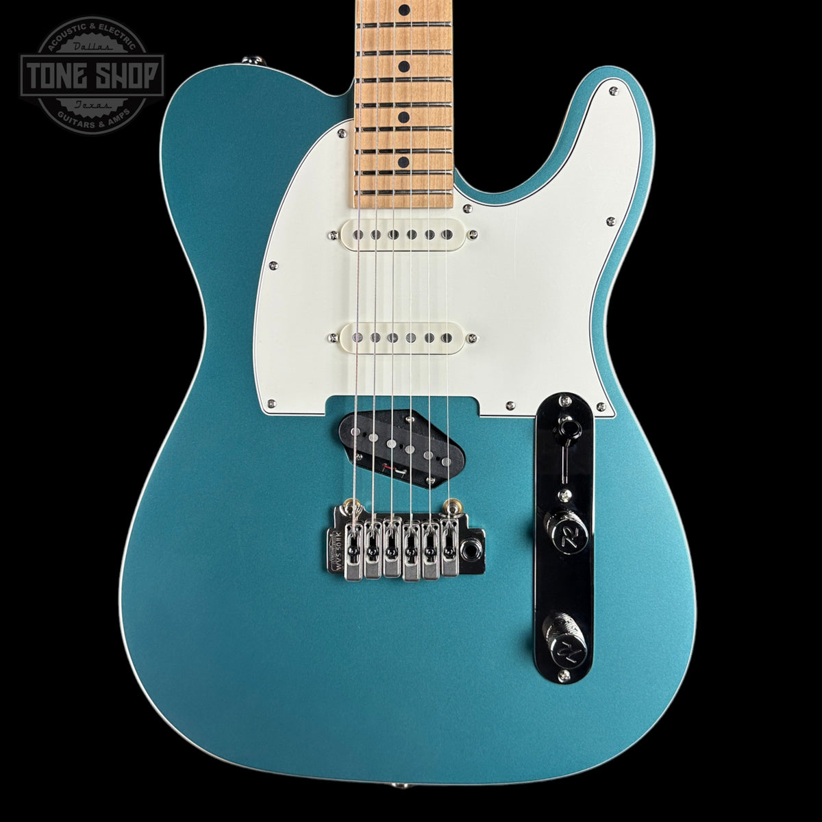 Blue electric guitar with a white pickguard on a black background, featuring 'Tone Shop' branding.