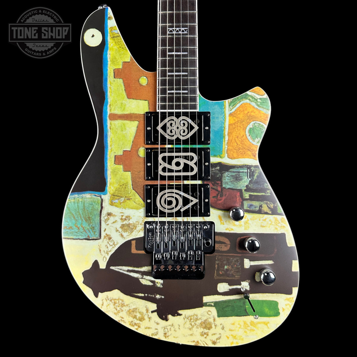 Colorful electric guitar with abstract design on a black background, featuring the Tone Shop logo.