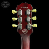 Guitar headstock with Epiphone logo on a black background