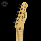 Fender Telecaster guitar headstock on a black background