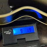 Used Epiphone Adam Jones Les Paul Silverburst on scale displaying weight.