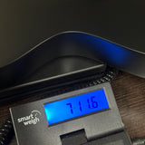 Used Sire Larry Carlton L3 Black on scale displaying weight.