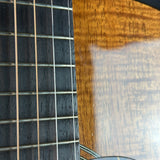Close-up of a guitar's fretboard and part of the body