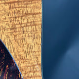 Close-up of a wooden surface and a dark blue material