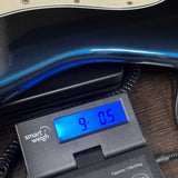 Used 1989 Fender Strat Plus on scale displaying weight.