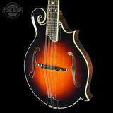Fretless mandolin with a dark brown finish on a black background, featuring the Tone Shop logo.