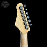 Guitar headstock with tuning pegs on a black background, featuring 'Tone Shop' logo.