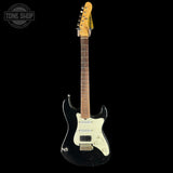 Black electric guitar with white pickguard on a black background, featuring 'Tone Shop' logo.