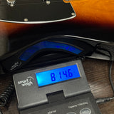Used 2021 Fender DLX Nashville Telecaster Sunburst on scale displaying weight.